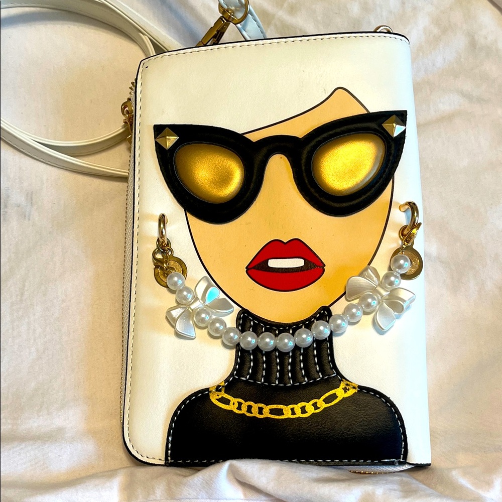 Stylish White and Black Women's Bag with Gold Accents